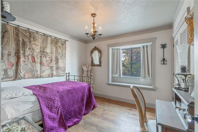 24042 Ingomar St, West Hills, CA 91304 - bedroom featuring ornamental molding, a textured ceiling, hardwood / wood-style flooring, and a chandelier