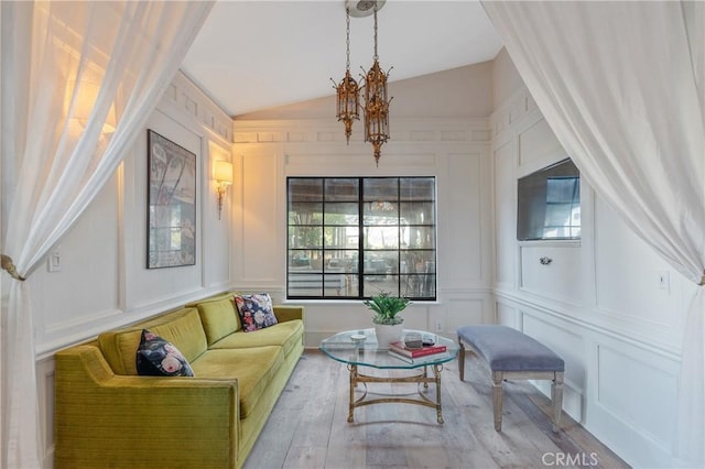24042 Ingomar St, West Hills, CA 91304 - living room with a decorative wall, lofted ceiling, wood finished floors, and a chandelier