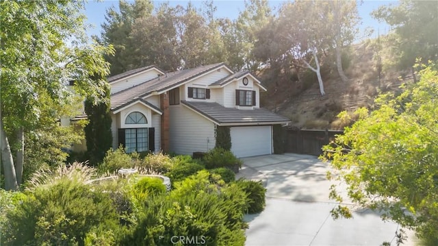 24042 Ingomar St, West Hills, CA 91304 - traditional-style home featuring concrete driveway and a garage