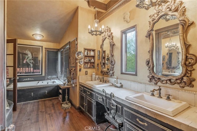 24042 Ingomar St, West Hills, CA 91304 - full bathroom with a chandelier, double vanity, a bath, and wood finished floors