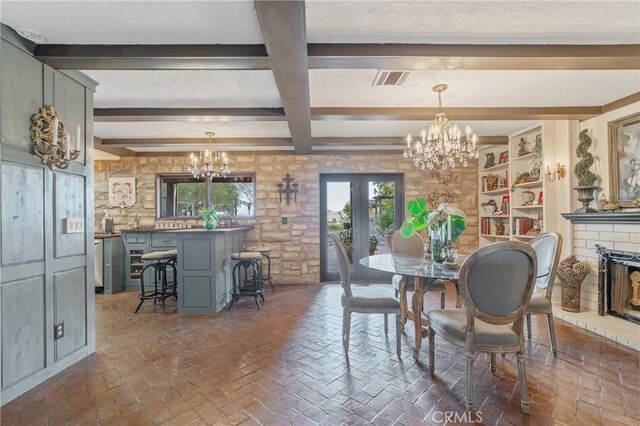 24042 Ingomar St, West Hills, CA 91304 - dining room with a chandelier, beam ceiling, a fireplace, and brick flooring