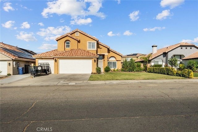 37152 57th St E, Palmdale, CA 93552 - view of front of property featuring an attached garage, stucco siding, driveway, a front lawn, and a tile roof