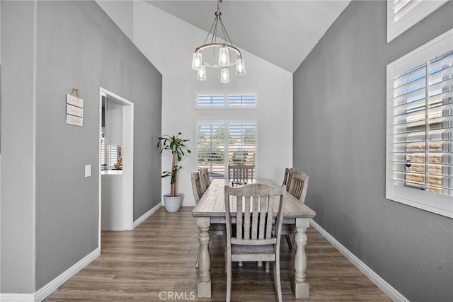 37152 57th St E, Palmdale, CA 93552 - dining room featuring high vaulted ceiling, wood finished floors, and a chandelier