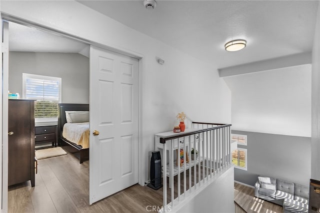 37152 57th St E, Palmdale, CA 93552 - hall with an upstairs landing, wood finished floors, lofted ceiling, and a textured ceiling
