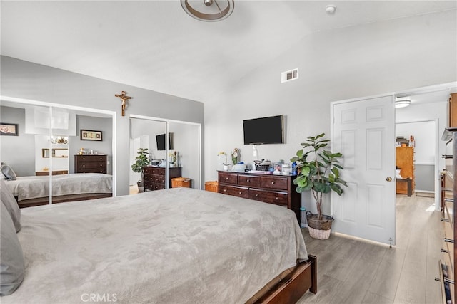 37152 57th St E, Palmdale, CA 93552 - bedroom featuring light wood-style flooring and high vaulted ceiling