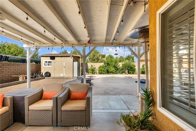 37152 57th St E, Palmdale, CA 93552 - fenced backyard with a patio area and a storage shed