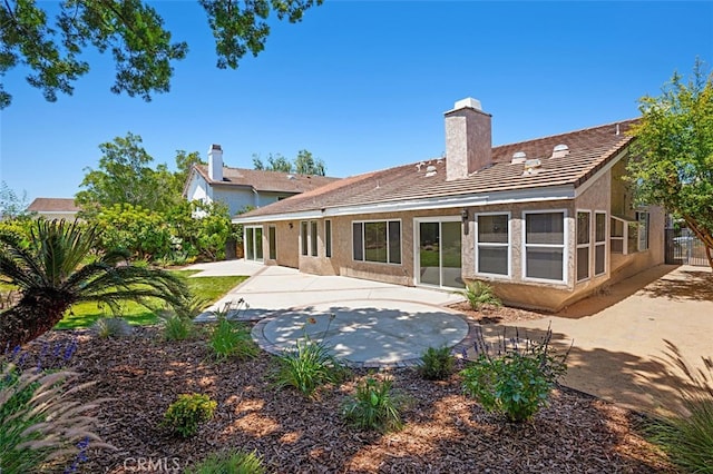 3386 Montagne Way, Thousand Oaks, CA 91362 - rear view of house featuring a patio area, a chimney, and stucco siding