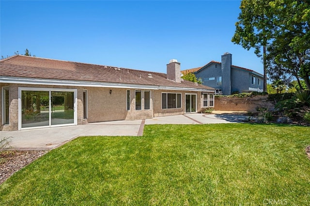 3386 Montagne Way, Thousand Oaks, CA 91362 - back of property featuring a patio, a chimney, and stucco siding