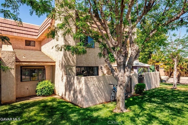 425 W W Ave J5, Unit 36, Lancaster, CA 93534 - rear view of property with stucco siding