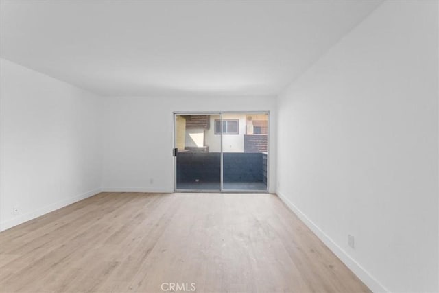 5403 Newcastle Ave Unit 19, Encino, CA 91316 - unfurnished room featuring wood finished floors and baseboards