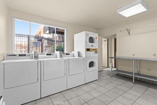 5403 Newcastle Ave Unit 19, Encino, CA 91316 - community laundry with independent washer and dryer, stacked washer / drying machine, and light tile patterned floors