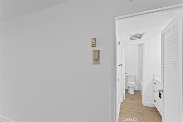 5403 Newcastle Ave Unit 19, Encino, CA 91316 - hall featuring light wood-style flooring and baseboards