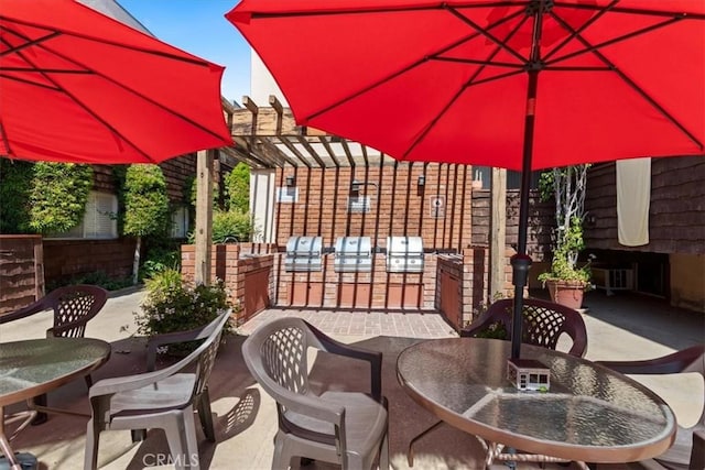 5403 Newcastle Ave Unit 19, Encino, CA 91316 - view of patio featuring outdoor dining area, area for grilling, and a pergola