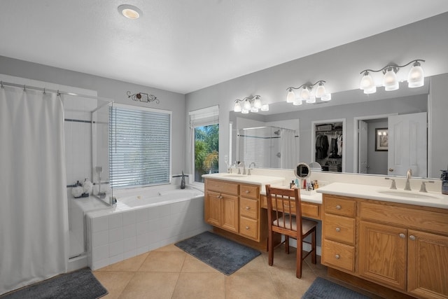42207 Kimberly Way, Murrieta, CA 92562 - bathroom featuring a shower stall, double vanity, tile patterned floors, a garden tub, and a spacious closet