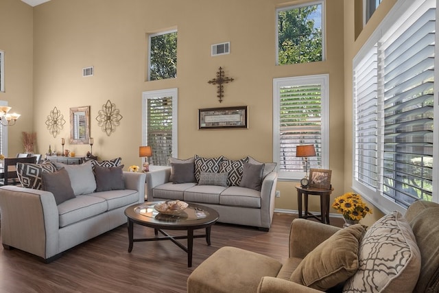 42207 Kimberly Way, Murrieta, CA 92562 - living area featuring a towering ceiling, dark wood-style flooring, and a chandelier