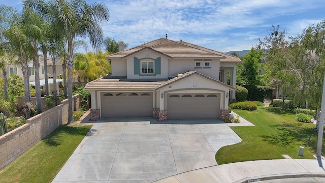 42207 Kimberly Way, Murrieta, CA 92562 - mediterranean / spanish-style house with stucco siding, driveway, an attached garage, and a tile roof