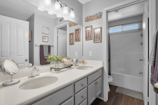42207 Kimberly Way, Murrieta, CA 92562 - full bath featuring double vanity, shower / bath combo, and wood finished floors