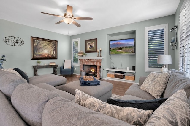 42207 Kimberly Way, Murrieta, CA 92562 - living room with ceiling fan, wood finished floors, and a fireplace