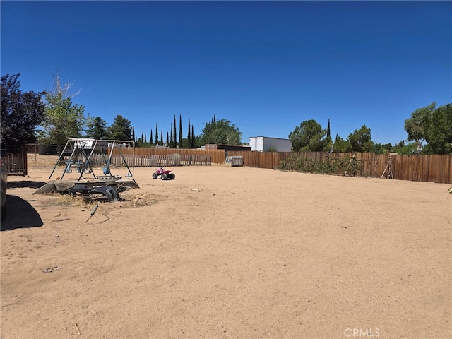 9294 Manteca Ave, Hesperia, CA 92345 - fenced backyard with a playground