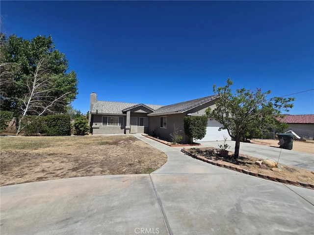 9294 Manteca Ave, Hesperia, CA 92345 - single story home featuring driveway, a chimney, an attached garage, and stucco siding