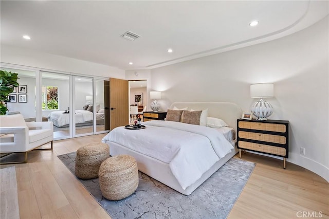 439 S Lamer St, Burbank, CA 91506 - bedroom with light wood-style flooring, recessed lighting, and french doors