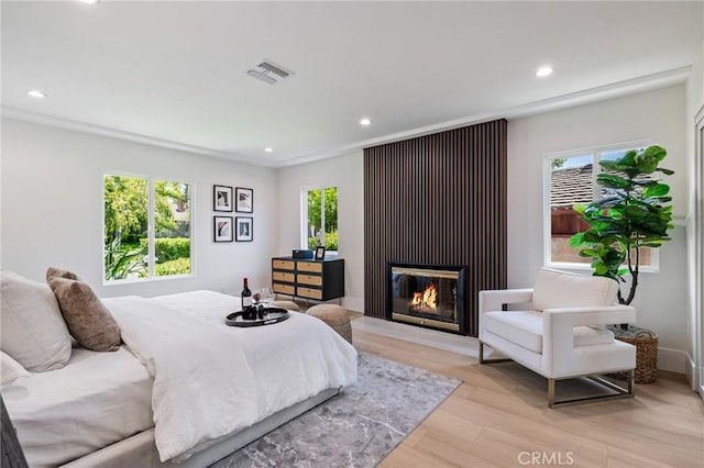 439 S Lamer St, Burbank, CA 91506 - bedroom with recessed lighting, light wood-style floors, and a fireplace with flush hearth