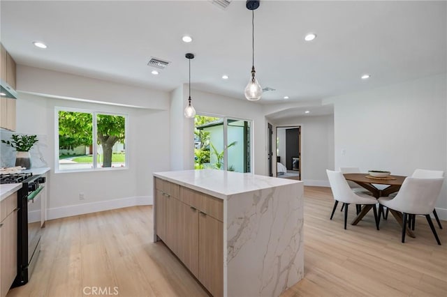 439 S Lamer St, Burbank, CA 91506 - kitchen featuring gas range, modern cabinets, light wood-type flooring, a kitchen island, and recessed lighting