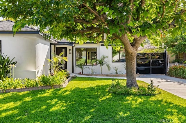 439 S Lamer St, Burbank, CA 91506 - view of front of home featuring stucco siding, a front lawn, and roof with shingles