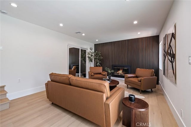 439 S Lamer St, Burbank, CA 91506 - living room with recessed lighting, light wood-type flooring, and a glass covered fireplace