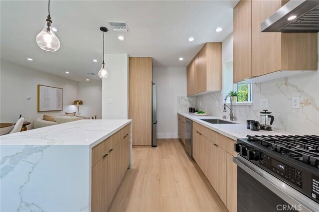 439 S Lamer St, Burbank, CA 91506 - kitchen featuring exhaust hood, stainless steel appliances, modern cabinets, light brown cabinets, and light stone counters