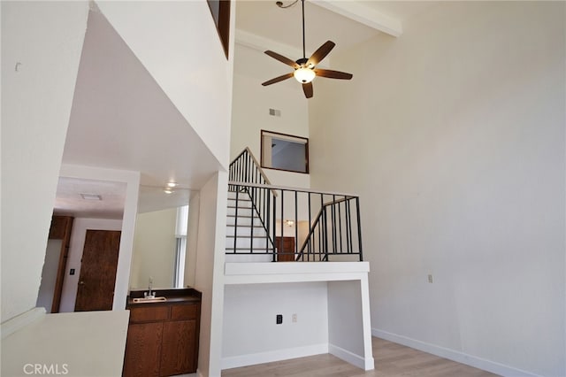 3350 M St Unit 33, Merced, CA 95348 - stairway with high vaulted ceiling, ceiling fan, beam ceiling, and wood finished floors
