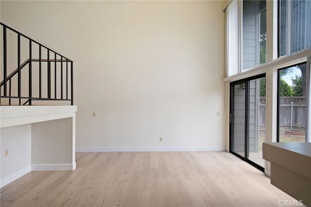 3350 M St Unit 33, Merced, CA 95348 - unfurnished living room with wood finished floors and a high ceiling