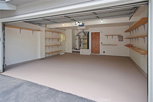 3350 M St Unit 33, Merced, CA 95348 - garage featuring water heater and a garage door opener