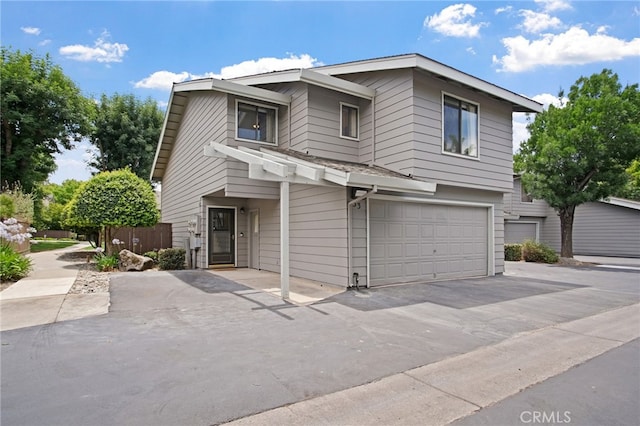 3350 M St Unit 33, Merced, CA 95348 - view of front of home featuring a garage and asphalt driveway
