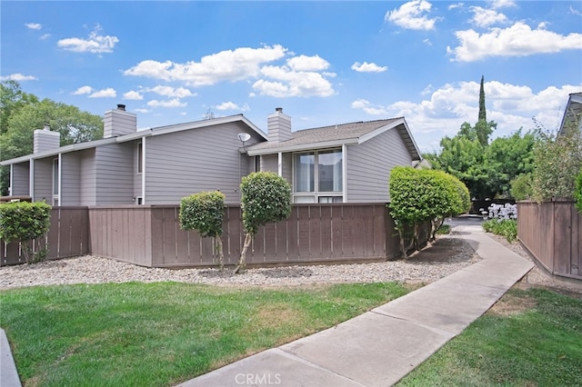 3350 M St Unit 33, Merced, CA 95348 - view of side of property featuring a chimney