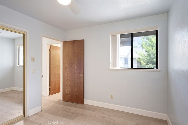 3350 M St Unit 33, Merced, CA 95348 - unfurnished bedroom featuring light wood-style floors and a ceiling fan