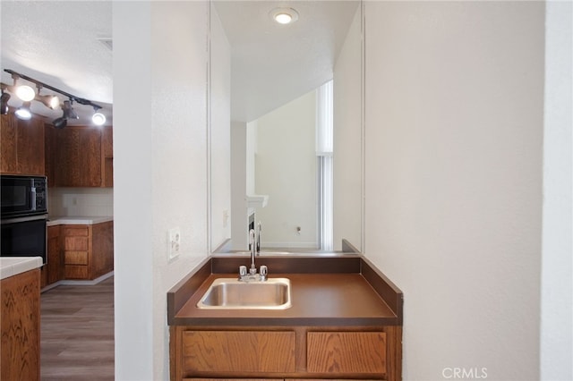 3350 M St Unit 33, Merced, CA 95348 - bathroom featuring a sink and wood finished floors