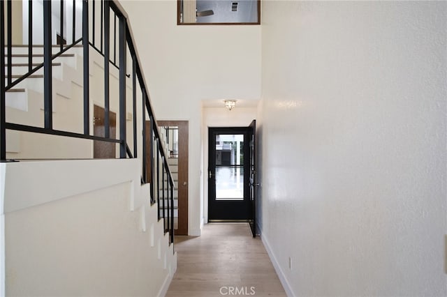 3350 M St Unit 33, Merced, CA 95348 - doorway to outside featuring wood finished floors and stairway