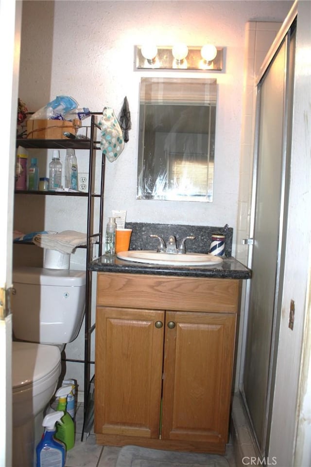 6400 Tournament Dr, Jurupa Valley, CA 92509 - full bath featuring vanity, a stall shower, and a textured wall