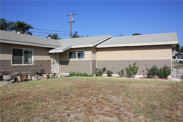 6400 Tournament Dr, Jurupa Valley, CA 92509 - view of front of house with a front lawn and stucco siding
