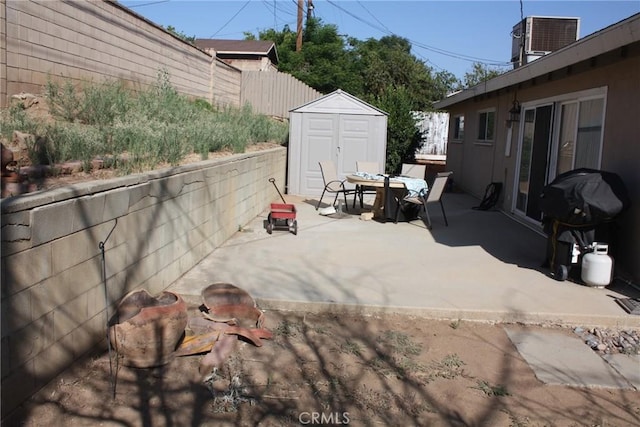 6400 Tournament Dr, Jurupa Valley, CA 92509 - view of patio / terrace with a storage shed, grilling area, and outdoor dining area