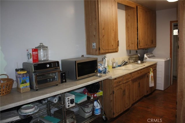 6400 Tournament Dr, Jurupa Valley, CA 92509 - kitchen with stainless steel microwave, dark wood-type flooring, light countertops, and brown cabinets