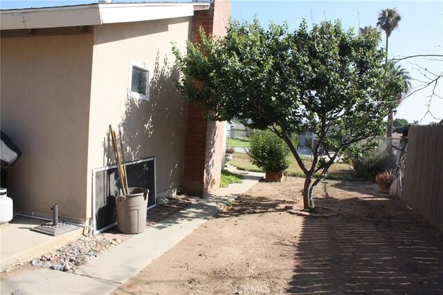 6400 Tournament Dr, Jurupa Valley, CA 92509 - view of home's exterior with stucco siding and a patio