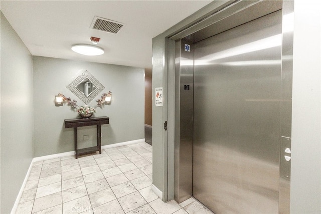11124 Burbank Blvd Unit 101, North Hollywood, CA 91601 - hallway featuring elevator and baseboards