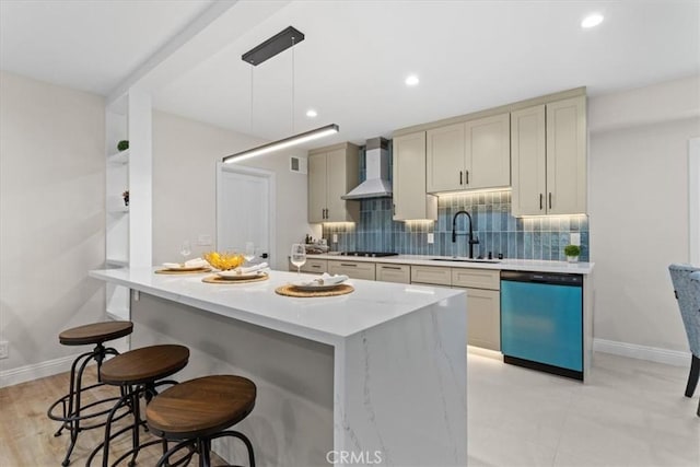 16842 Liggett St, Los Angeles, CA 91343 - kitchen featuring dishwasher, wall chimney exhaust hood, backsplash, a kitchen bar, and a kitchen island