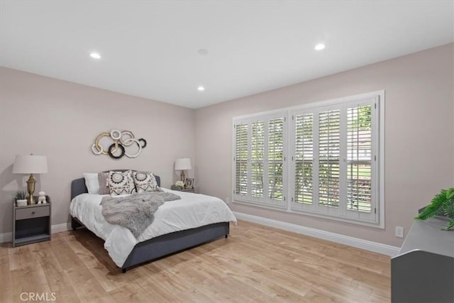 16842 Liggett St, Los Angeles, CA 91343 - bedroom with light wood-style floors and recessed lighting