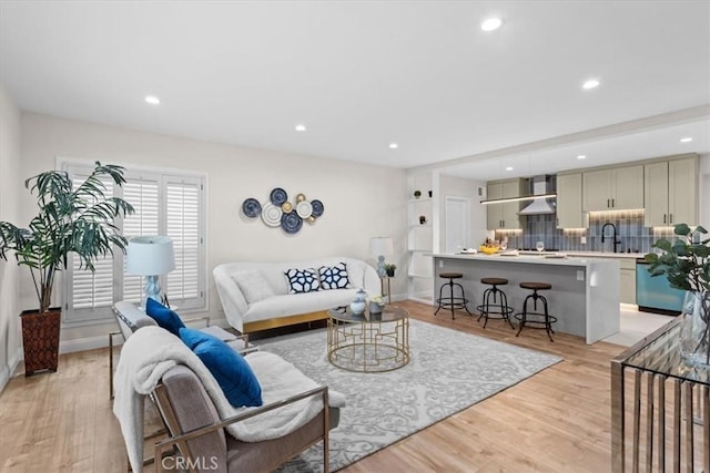 16842 Liggett St, Los Angeles, CA 91343 - living room with light wood-style floors and recessed lighting