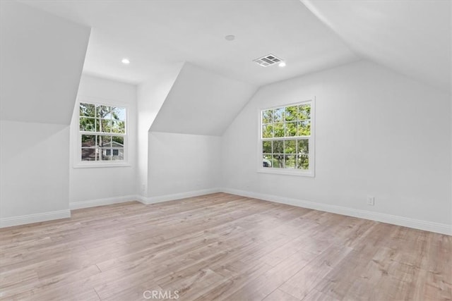 16842 Liggett St, Los Angeles, CA 91343 - additional living space with lofted ceiling, healthy amount of natural light, wood finished floors, and recessed lighting