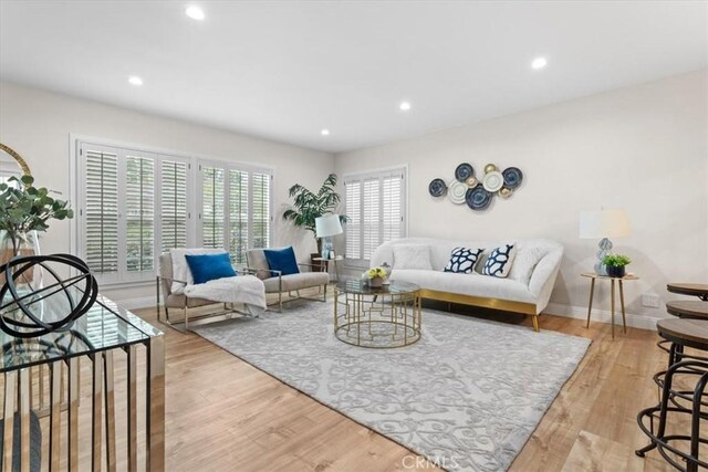 16842 Liggett St, Los Angeles, CA 91343 - living room with wood finished floors and recessed lighting