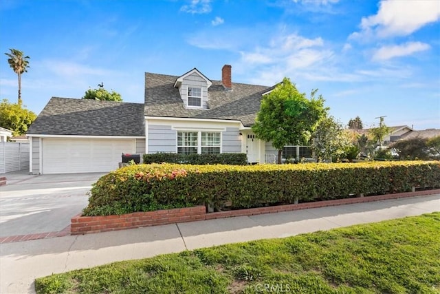 16842 Liggett St, Los Angeles, CA 91343 - view of front of house with a chimney, driveway, a garage, and roof with shingles